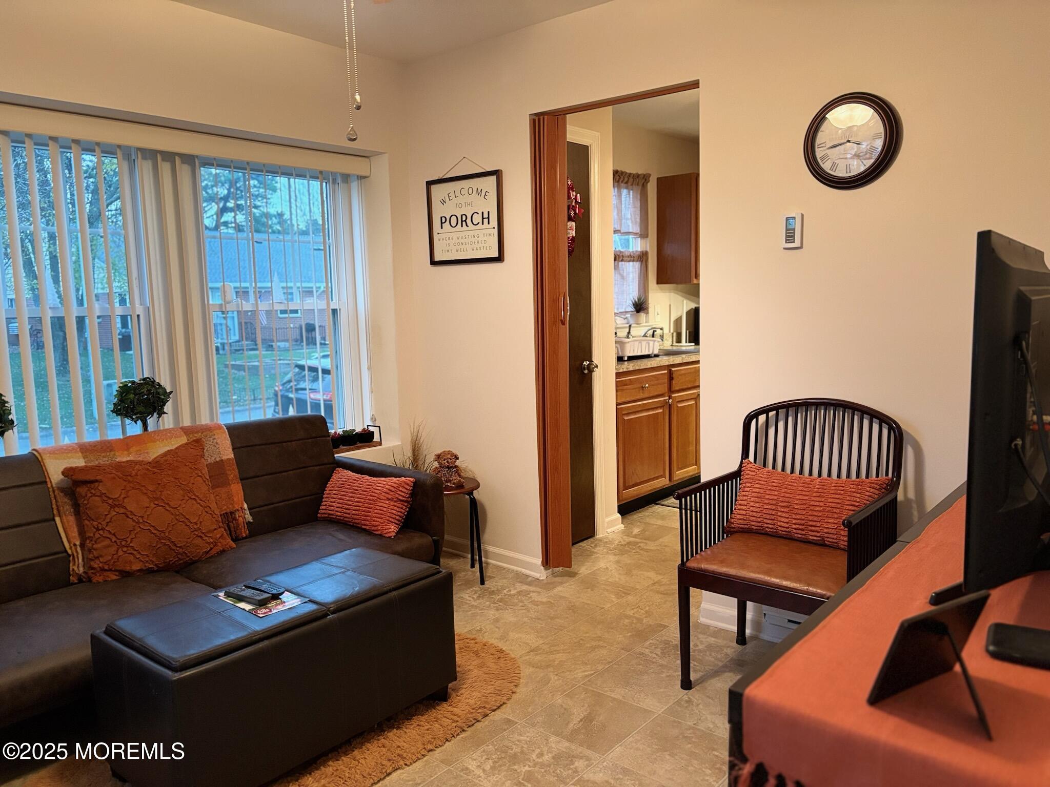 10 Constitution Boulevard, Unit B Whiting, NJ 08759 - Photo 20 of 57 a living room with furniture and a window