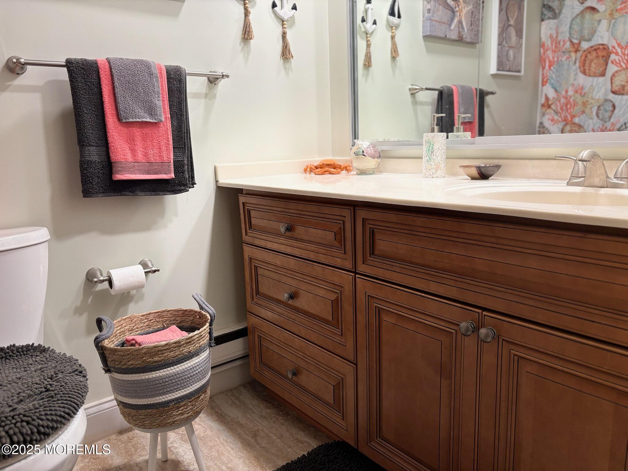 10 Constitution Boulevard, Unit B Whiting, NJ 08759 - Photo 44 of 57 a bathroom with a sink mirror and toilet