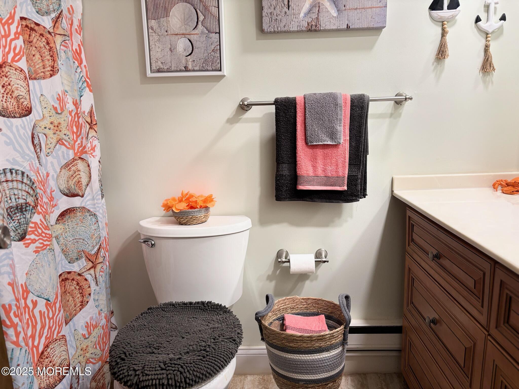 10 Constitution Boulevard, Unit B Whiting, NJ 08759 - Photo 45 of 57 a bathroom with a toilet and a shower curtain