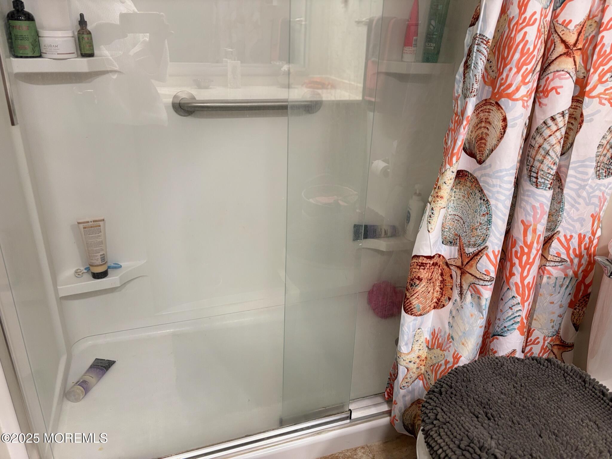 10 Constitution Boulevard, Unit B Whiting, NJ 08759 - Photo 46 of 57 a bathroom with a bathtub and shower