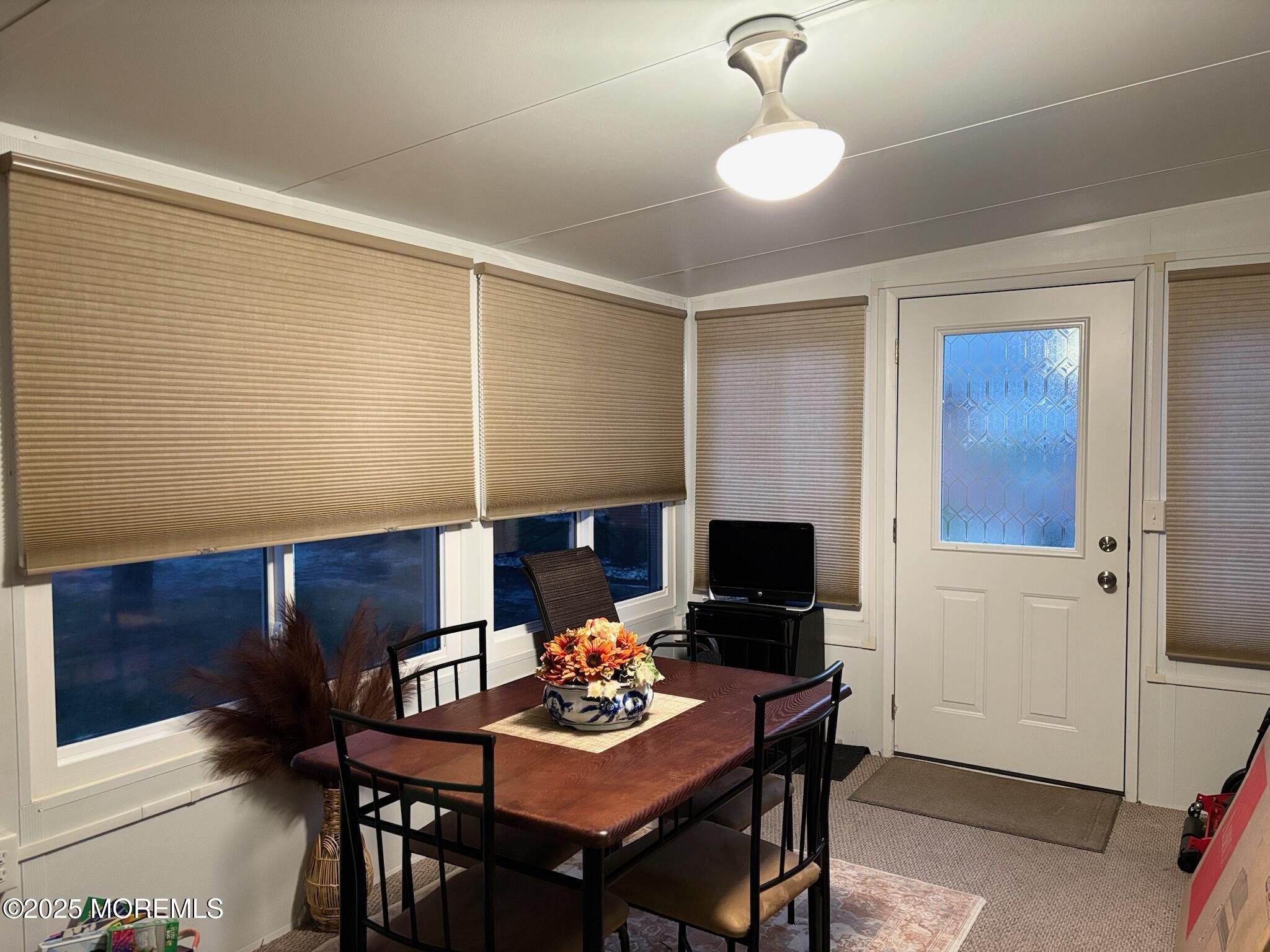 10 Constitution Boulevard, Unit B Whiting, NJ 08759 - Photo 52 of 57 a living room with furniture and a flat screen tv