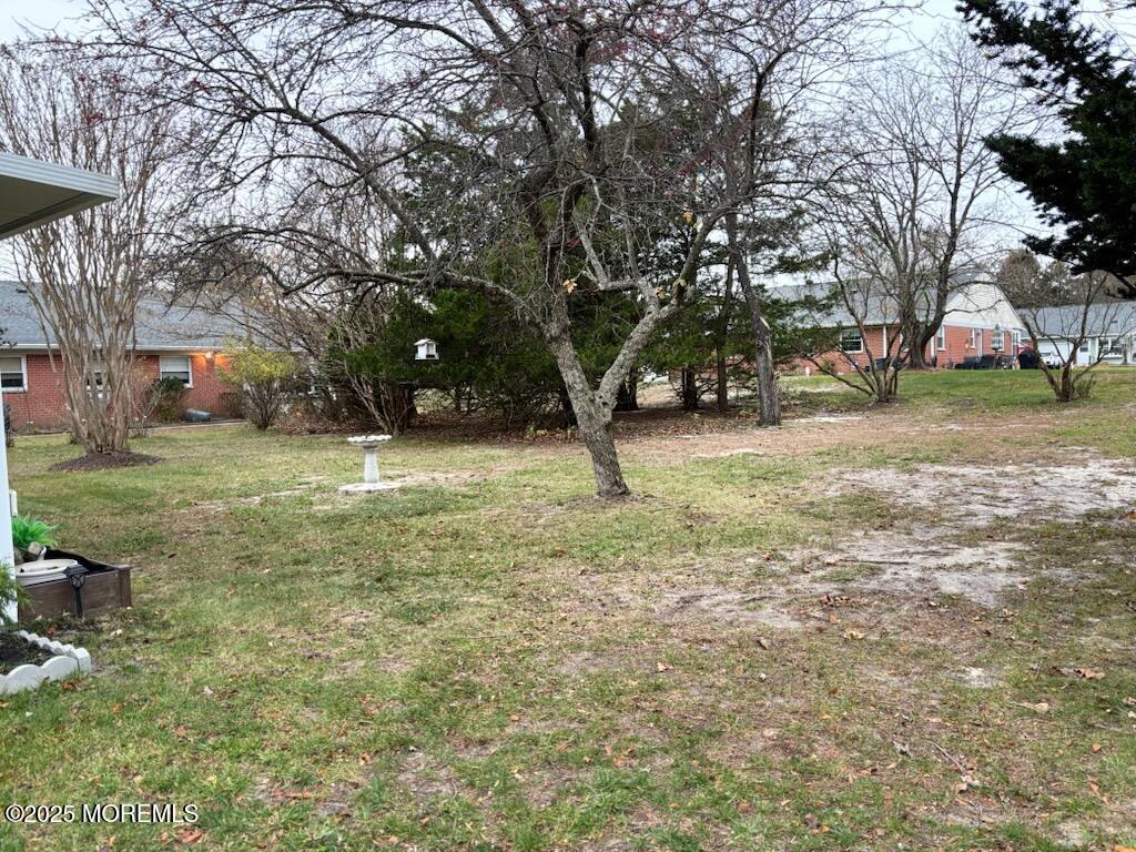 10 Constitution Boulevard, Unit B Whiting, NJ 08759 - Photo 8 of 57 a view of a yard with a house