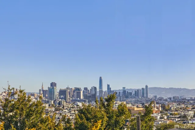 a view of a city with tall buildings in the background