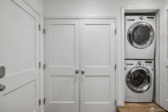 a view of a hallway with washer and dryer