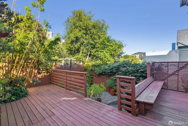 a wooden bench sitting on top of a wooden roof