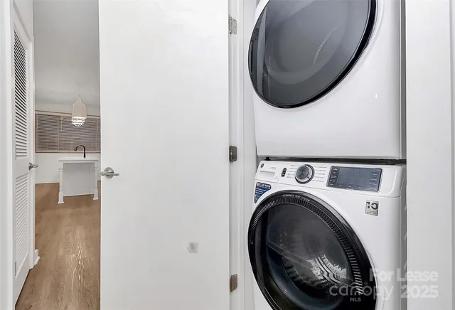 a close view of a utility room with dryer and washer