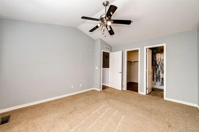 a view of room with a ceiling fan