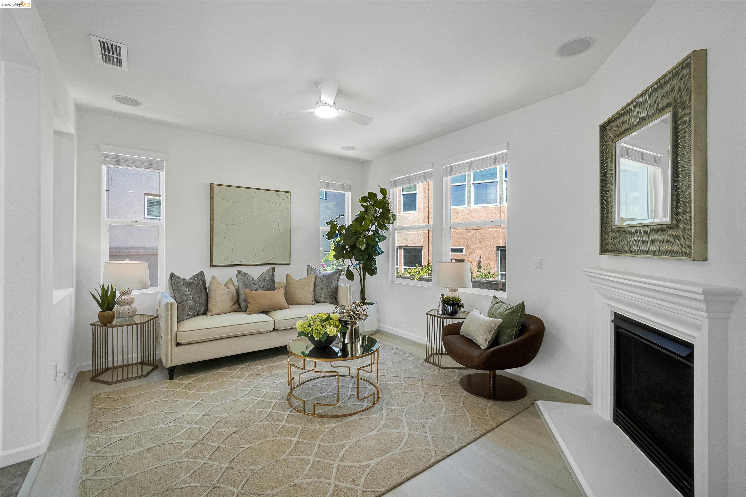 449 Constantine Court San Ramon, CA 94583 - Photo 12 of 63 Living area featuring a white fireplace with a classic mantel, multiple large windows, and recessed lighting