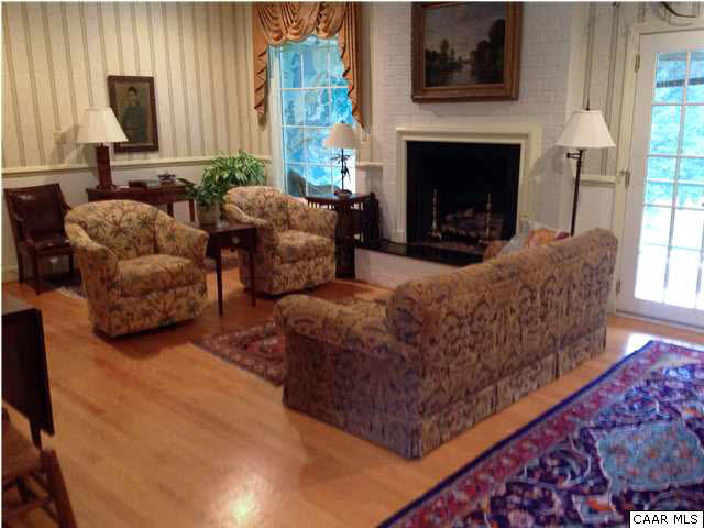 6 Canterbury Road Charlottesville, VA 22903 - Photo 2 of 8 a living room with furniture and a fireplace