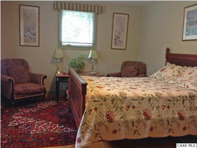 6 Canterbury Road Charlottesville, VA 22903 - Photo 5 of 8 a bedroom with a bed and a couch