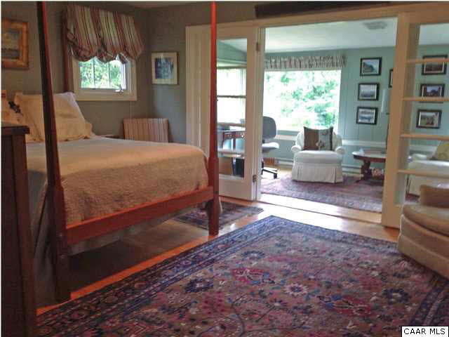 6 Canterbury Road Charlottesville, VA 22903 - Photo 6 of 8 a bed sitting in a bedroom next to a window