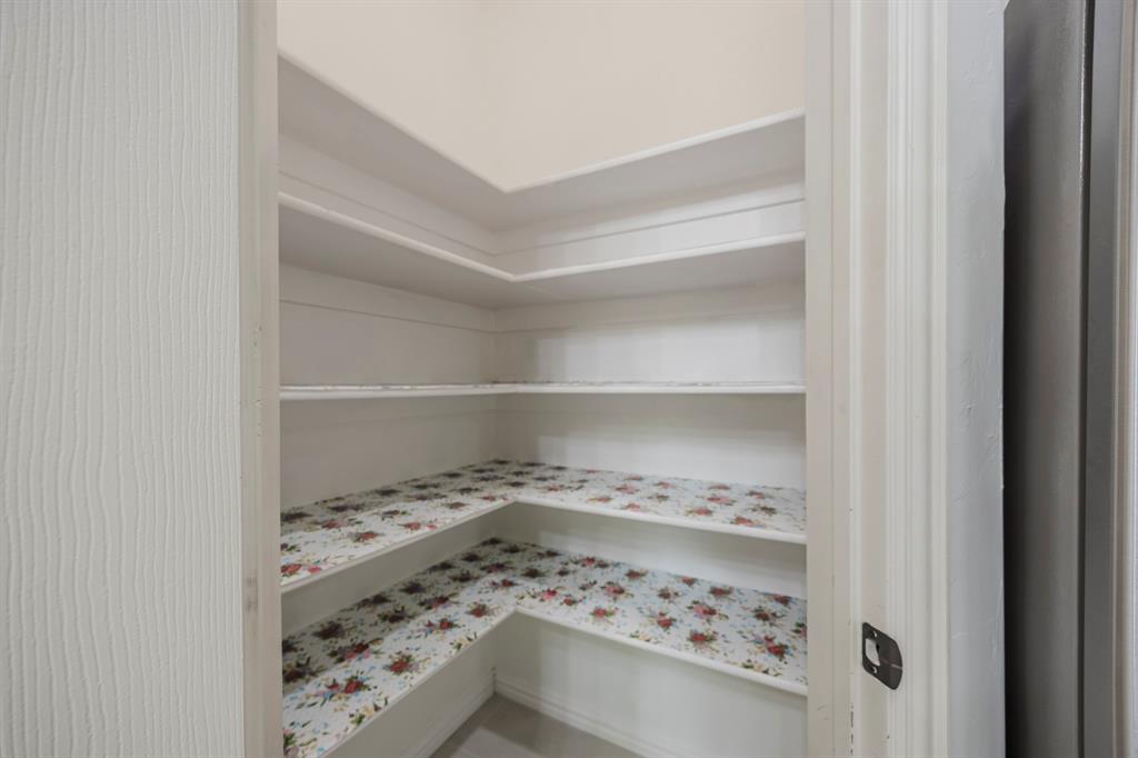 362 Spring Meadow Drive Fairview, TX 75069 - Photo 13 of 38 a view of a walk in closet with wooden floor
