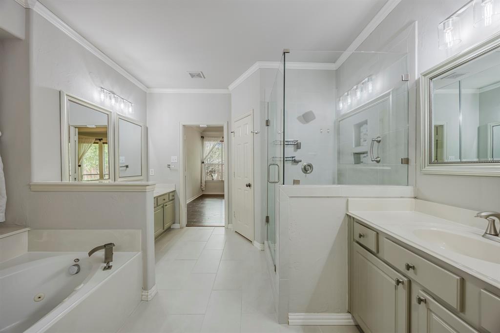 362 Spring Meadow Drive Fairview, TX 75069 - Photo 23 of 38 a bathroom with a tub sink and mirror