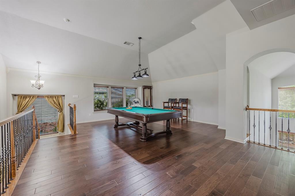 362 Spring Meadow Drive Fairview, TX 75069 - Photo 25 of 38 a living room with furniture and a wooden floor