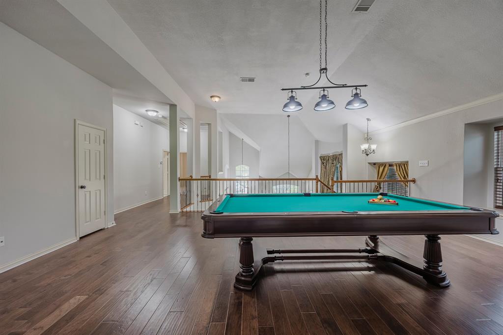 362 Spring Meadow Drive Fairview, TX 75069 - Photo 26 of 38 a room with pool table and windows