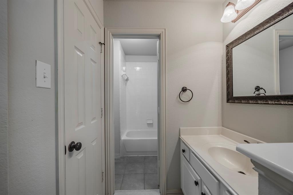 362 Spring Meadow Drive Fairview, TX 75069 - Photo 28 of 38 a bathroom with a shower sink and mirror
