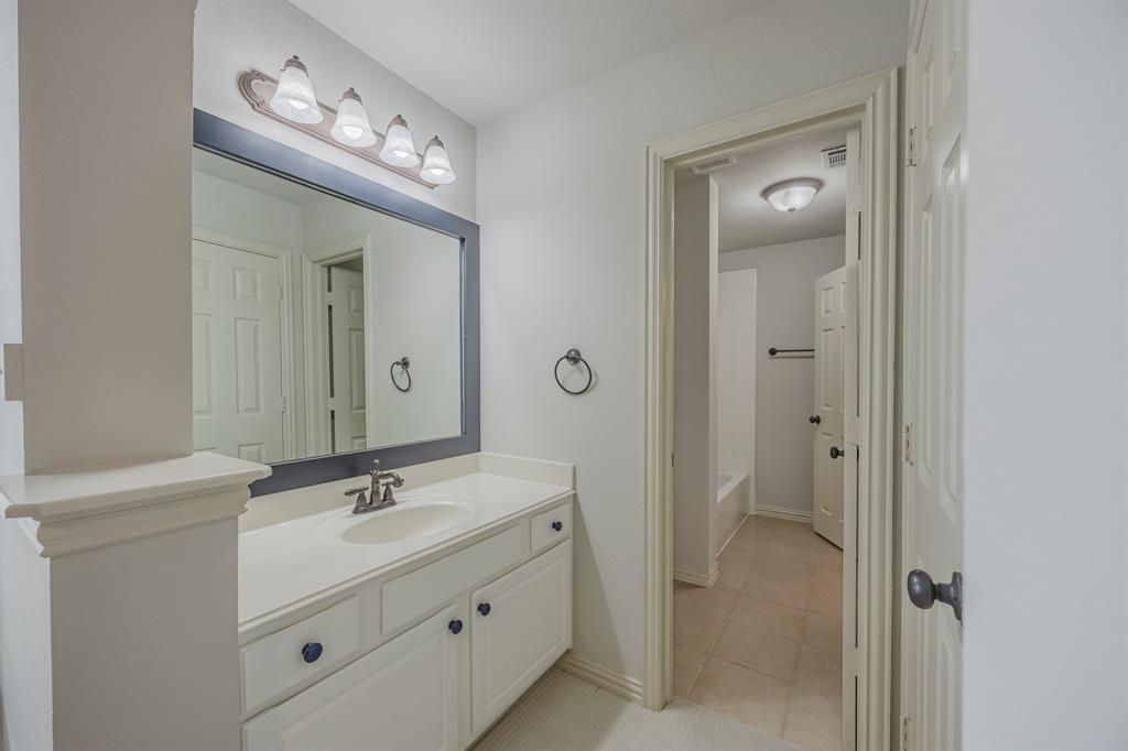 362 Spring Meadow Drive Fairview, TX 75069 - Photo 29 of 38 a bathroom with a double vanity sink and mirror with shower