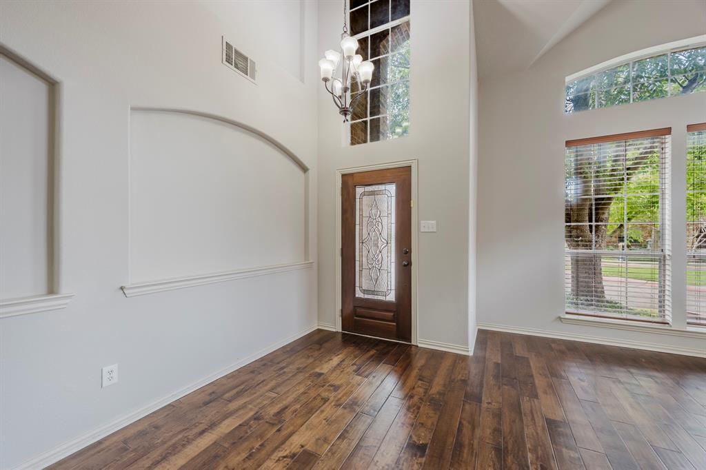 362 Spring Meadow Drive Fairview, TX 75069 - Photo 3 of 38 a view of livingroom with hardwood floor and hallway