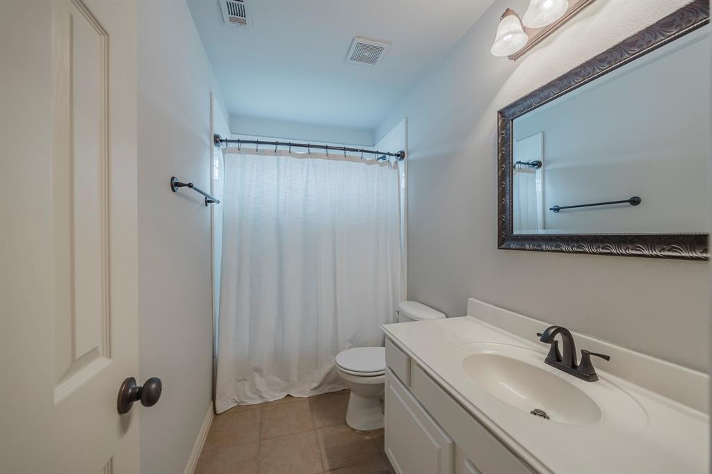 362 Spring Meadow Drive Fairview, TX 75069 - Photo 31 of 38 a bathroom with a sink a toilet and shower
