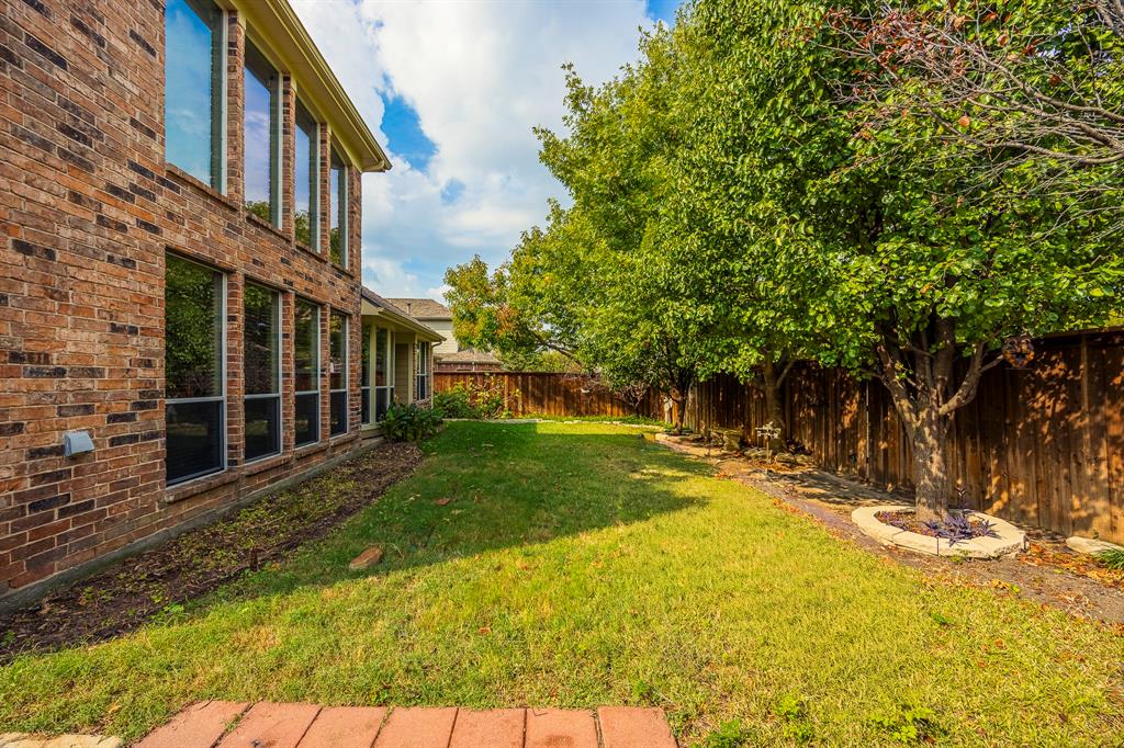 362 Spring Meadow Drive Fairview, TX 75069 - Photo 36 of 38 a view of a yard with plants and large trees