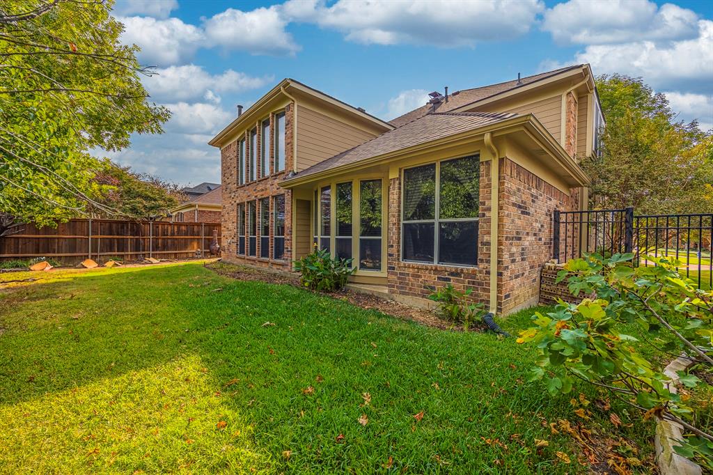 362 Spring Meadow Drive Fairview, TX 75069 - Photo 37 of 38 front view of a house with a yard