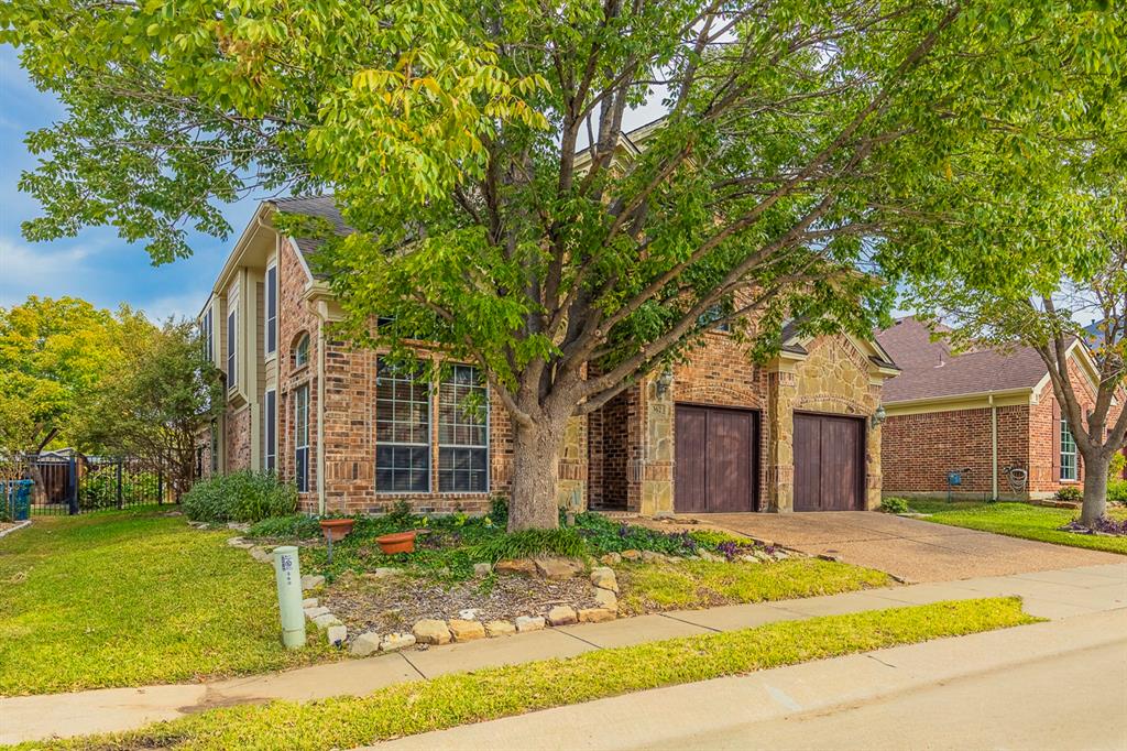 362 Spring Meadow Drive Fairview, TX 75069 - Photo 38 of 38 a brick house with trees in front of it