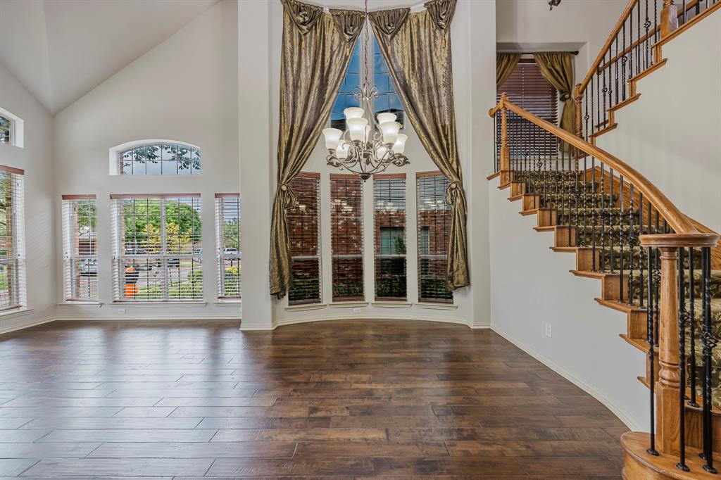 362 Spring Meadow Drive Fairview, TX 75069 - Photo 4 of 38 a view of an entryway with wooden floor and door