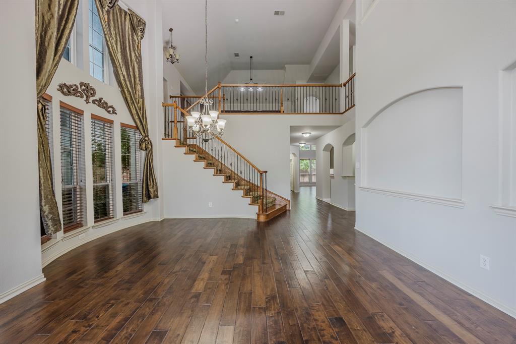 362 Spring Meadow Drive Fairview, TX 75069 - Photo 5 of 38 a view of entryway and hall with wooden floor