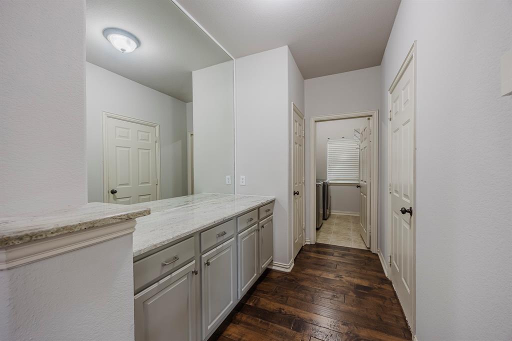 362 Spring Meadow Drive Fairview, TX 75069 - Photo 6 of 38 a bathroom with a sink and a mirror