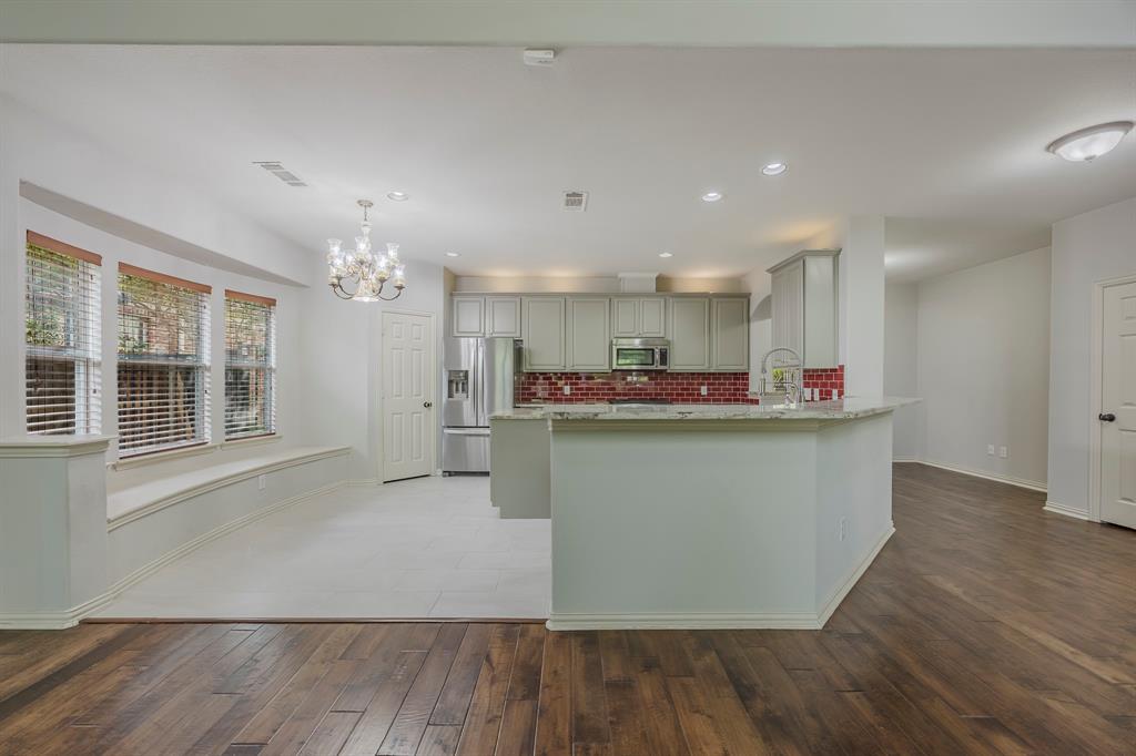 362 Spring Meadow Drive Fairview, TX 75069 - Photo 10 of 38 a view of kitchen with refrigerator and window