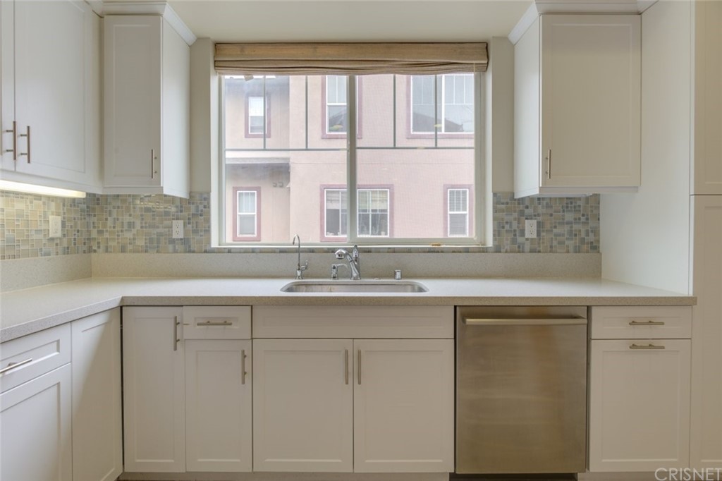 713 South Azusa Avenue, Unit D Azusa, CA 91702 - Photo 22 of 44 a kitchen with white cabinets and a window
