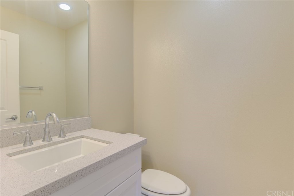 713 South Azusa Avenue, Unit D Azusa, CA 91702 - Photo 24 of 44 a bathroom with a sink a toilet and mirror