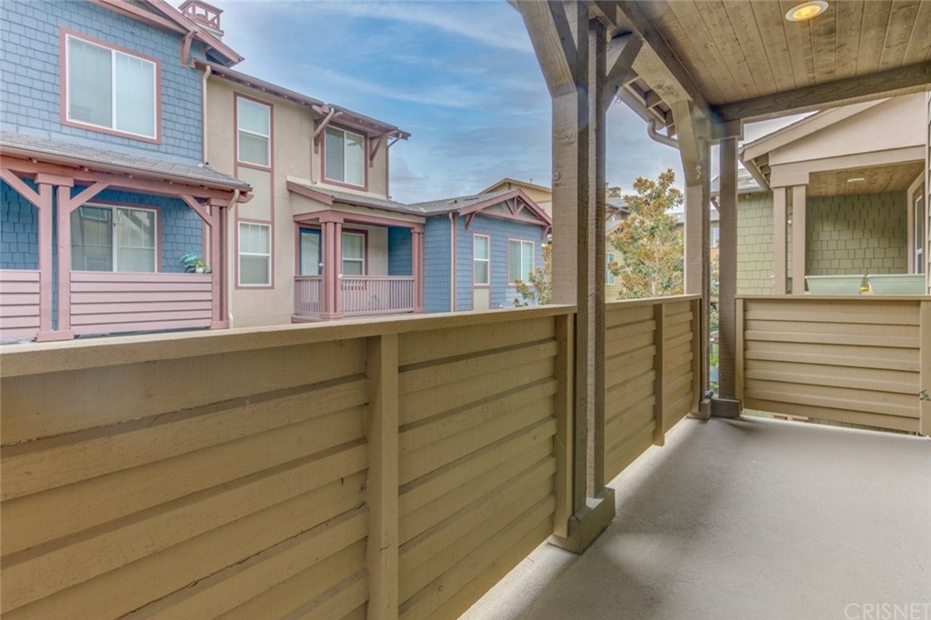 713 South Azusa Avenue, Unit D Azusa, CA 91702 - Photo 26 of 44 a view of a house with a door and a balcony