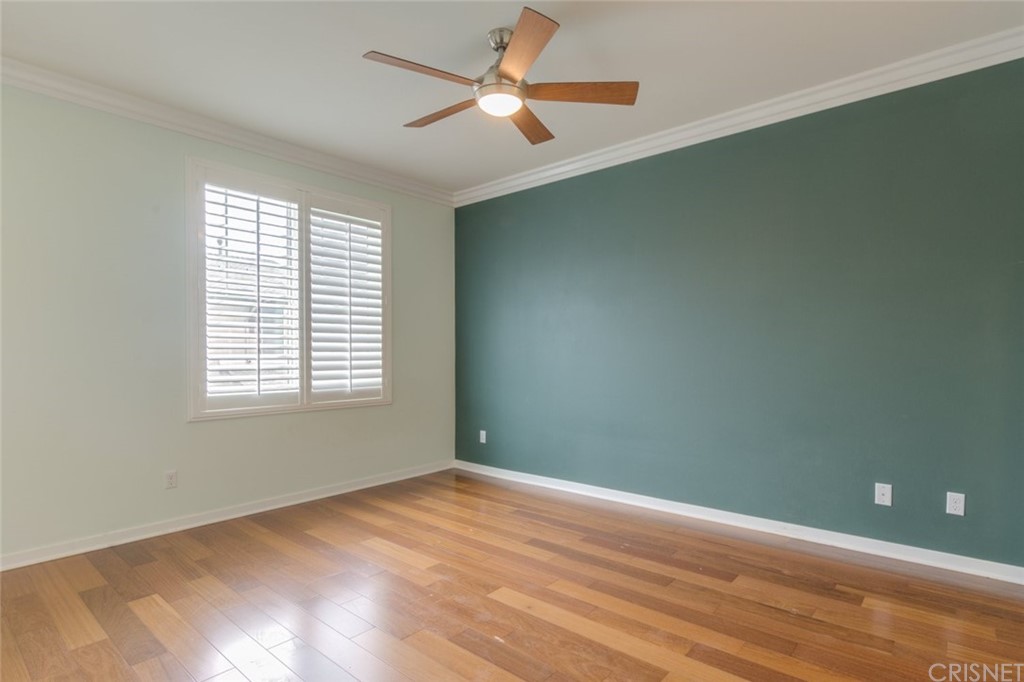 713 South Azusa Avenue, Unit D Azusa, CA 91702 - Photo 27 of 44 a view of empty room with wooden floor and fan