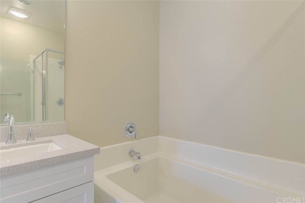 713 South Azusa Avenue, Unit D Azusa, CA 91702 - Photo 33 of 44 a bathroom with a sink and a bathtub
