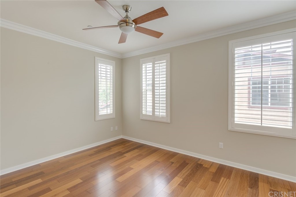 713 South Azusa Avenue, Unit D Azusa, CA 91702 - Photo 35 of 44 a view of empty room with wooden floor and fan
