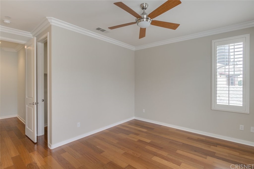 713 South Azusa Avenue, Unit D Azusa, CA 91702 - Photo 38 of 44 an empty room with wooden floor and windows