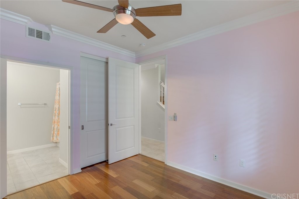 713 South Azusa Avenue, Unit D Azusa, CA 91702 - Photo 8 of 44 an empty room with wooden floor closet and fan