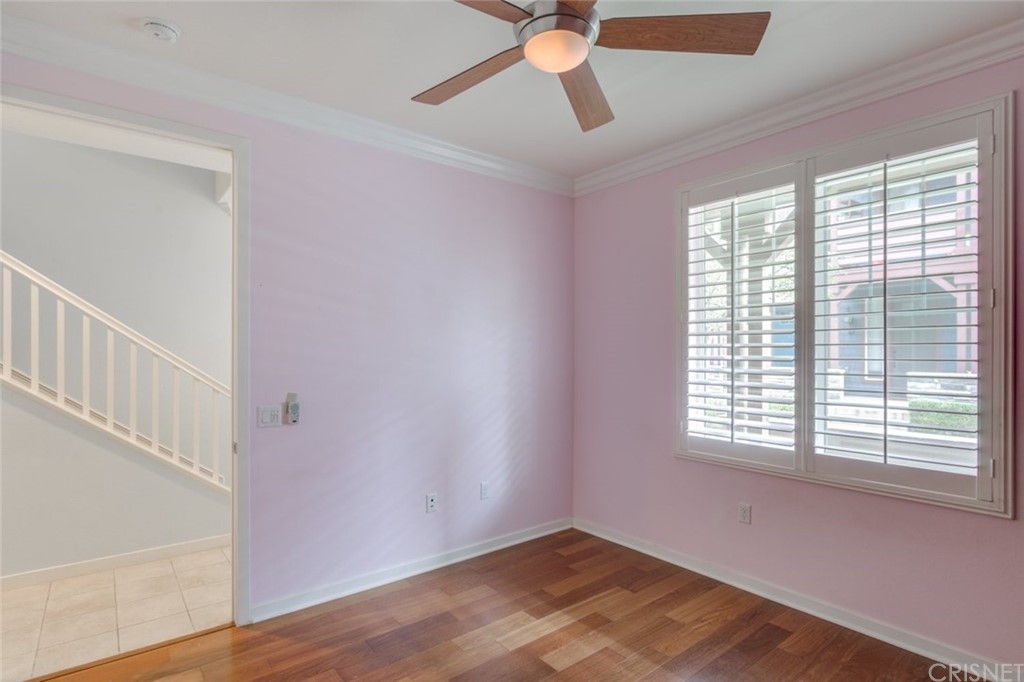 713 South Azusa Avenue, Unit D Azusa, CA 91702 - Photo 9 of 44 a view of an empty room with wooden floor and a window