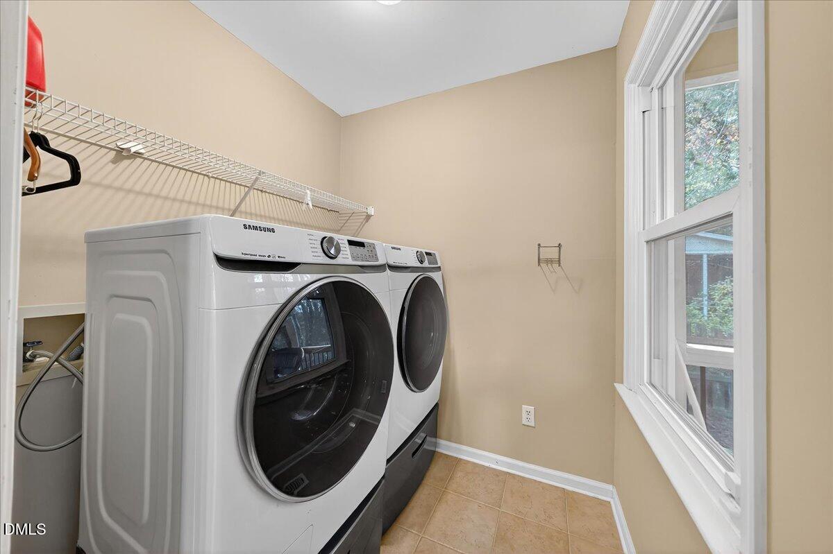 5608 Barham Court Raleigh, NC 27613 - Photo 23 of 37 a utility room with dryer and washer