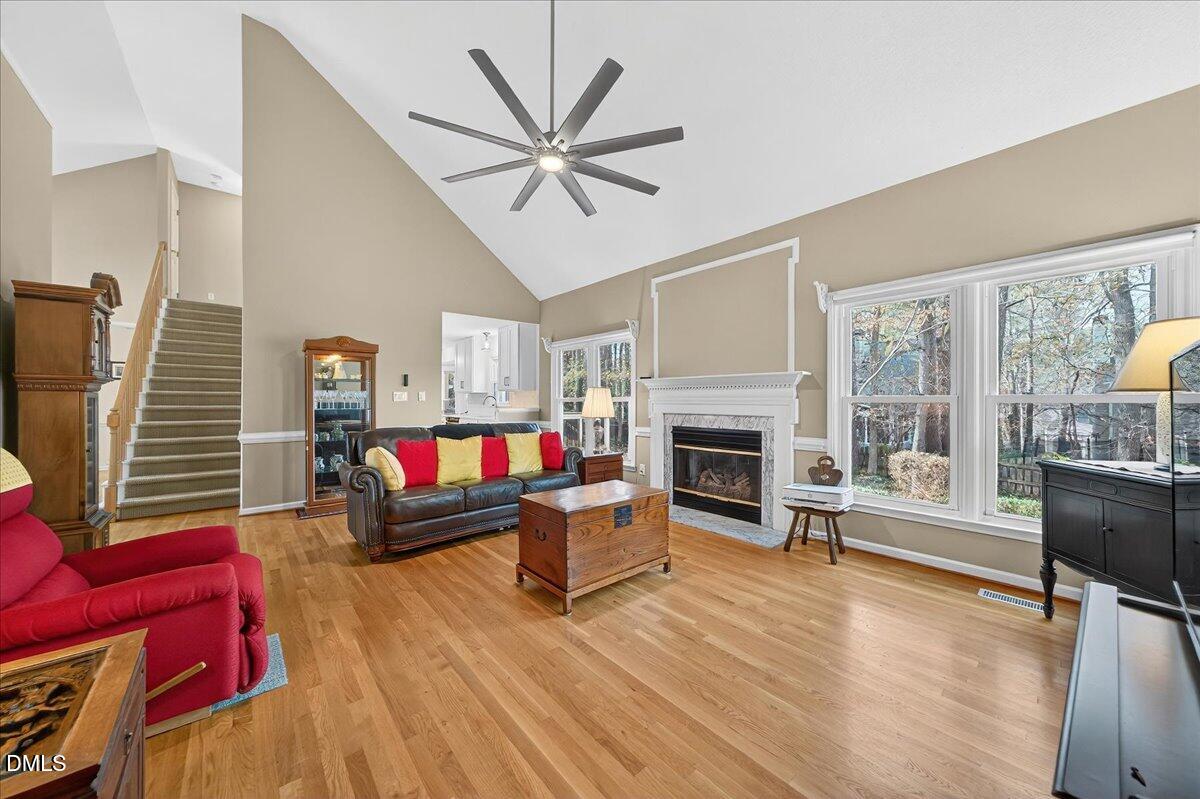 5608 Barham Court Raleigh, NC 27613 - Photo 8 of 37 a living room with furniture and a fireplace