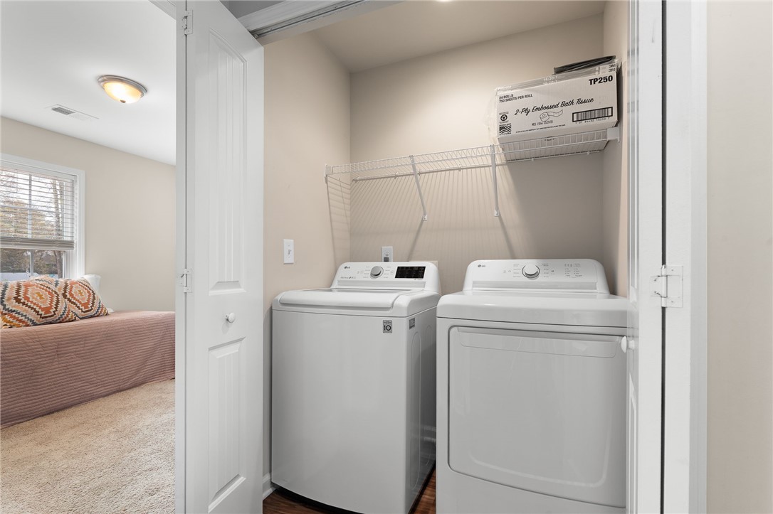 114 Sunny Pt Loop Central, SC 29630 - Photo 16 of 25 This dedicated laundry area offers convenient household utility, ensuring effortless living.