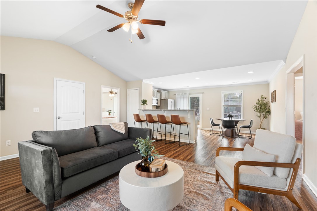 114 Sunny Pt Loop Central, SC 29630 - Photo 5 of 25 This inviting space features an open concept, connecting living and dining areas for effortless entertaining.