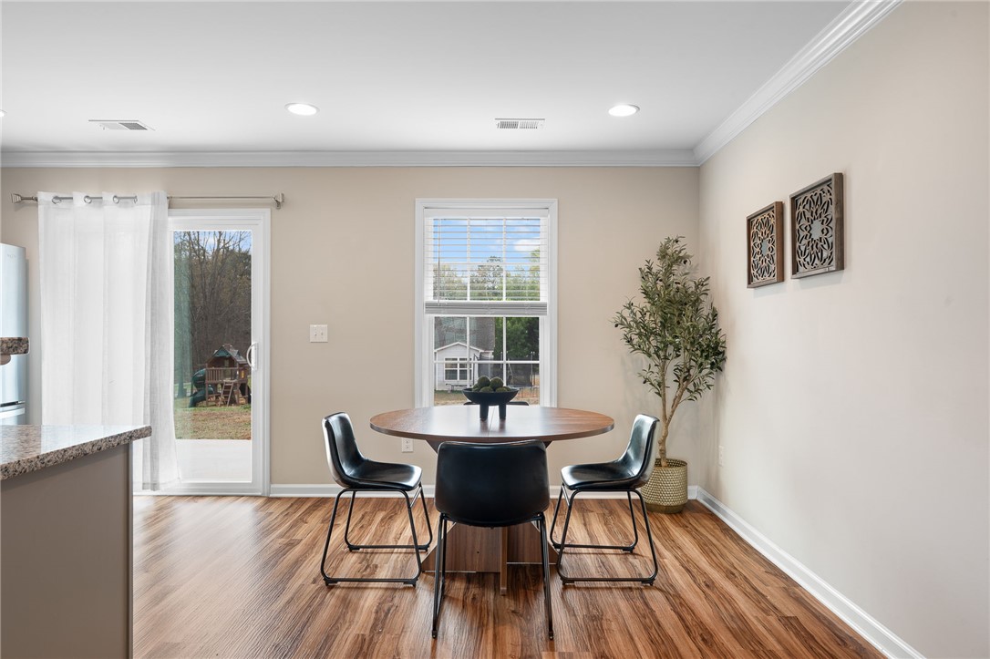 114 Sunny Pt Loop Central, SC 29630 - Photo 6 of 25 This bright dining area features ample natural light, creating an inviting space for gatherings.