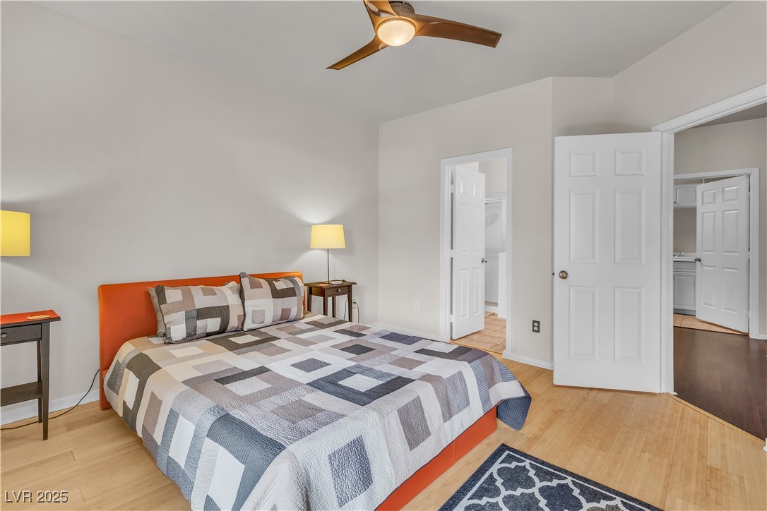 2050 West Warm Springs Road, Unit 1822 Henderson, NV 89014 - Photo 15 of 55 Bedroom featuring ceiling fan, baseboards, and bamboo wood finished floors
