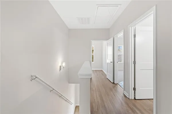 a view of a room with wooden floor