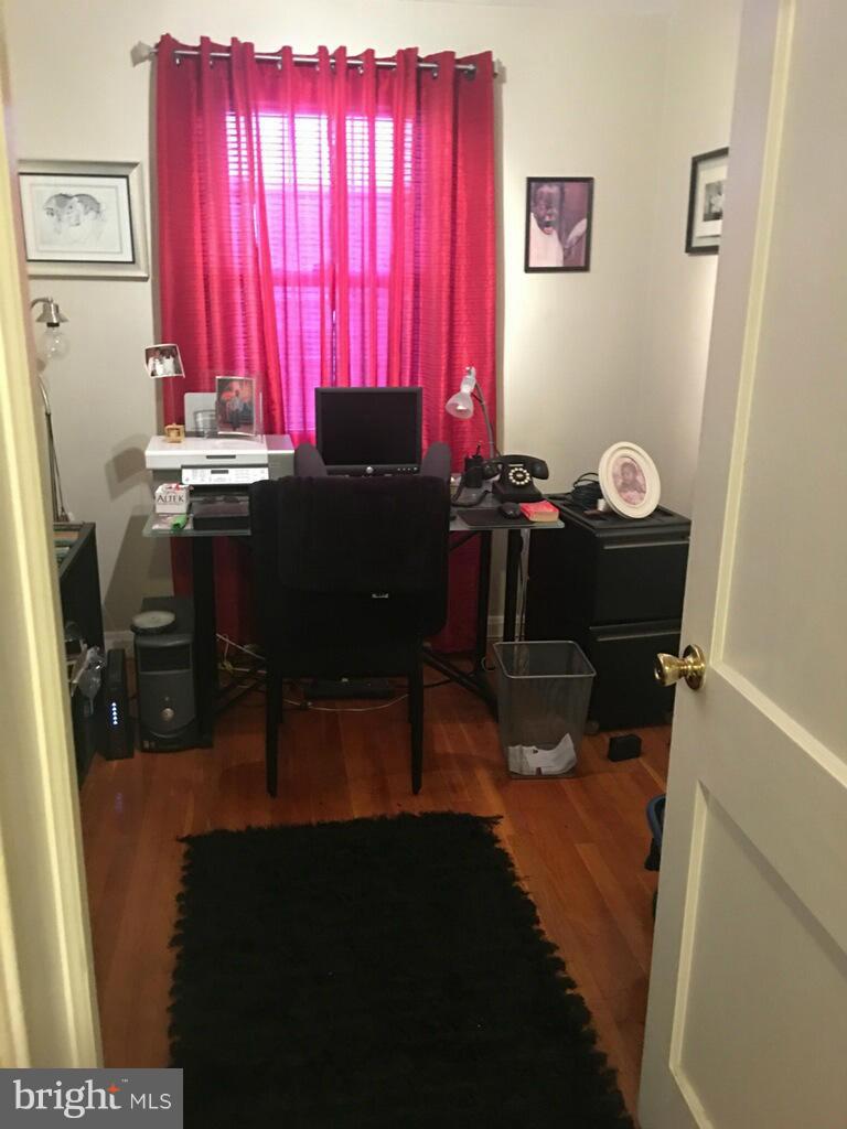 1242 Cedarcroft Road Baltimore, MD 21239 - Photo 15 of 22 a room with a chair and a table
