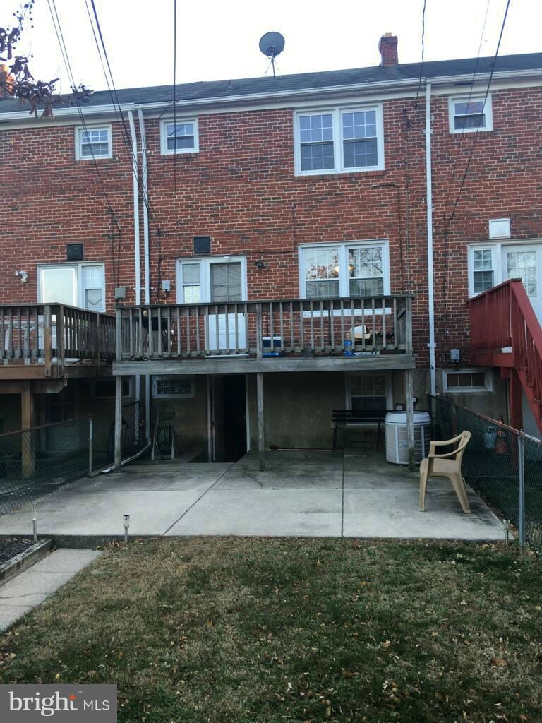 1242 Cedarcroft Road Baltimore, MD 21239 - Photo 3 of 22 a view of backyard with deck and outdoor seating