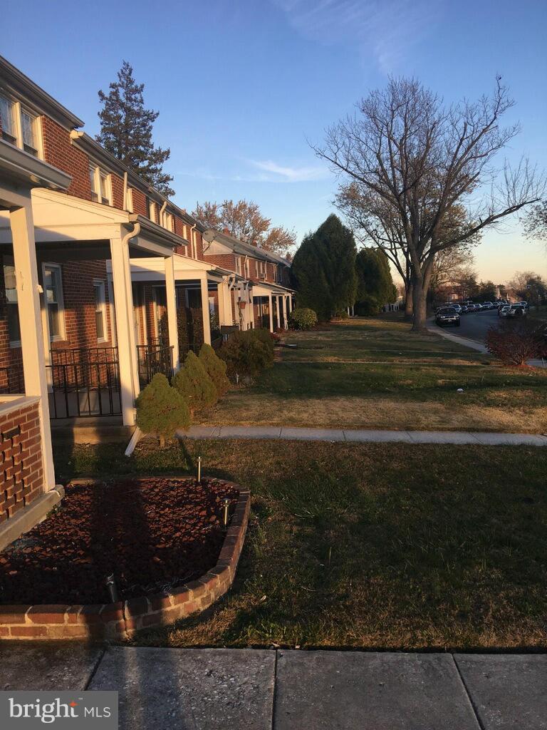 1242 Cedarcroft Road Baltimore, MD 21239 - Photo 4 of 22 a front view of a house with garden