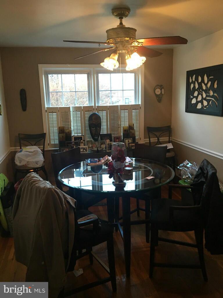 1242 Cedarcroft Road Baltimore, MD 21239 - Photo 8 of 22 a view of a dining room with furniture